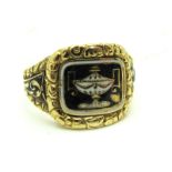 A Black and White Enamel Mourning Ring, detailed to the front with a twin handled lidded urn, with