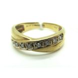 A Modern Diamond Set Band Ring, of crossover design, set throughout with uniform brilliant cut