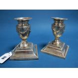 A Pair of Victorian Hallmarked Silver Candlesticks, RF, London 1884, each with ribbon tied swag