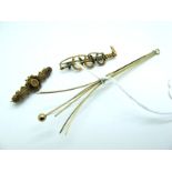 A 9ct Gold Swizzle Stick, telescopic, engine turned (open length 12cm); A Bar Brooch, as three