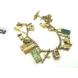 A Curb Link Charm Bracelet, to snap clasp stamped "585", suspending assorted novelty charm pendants,