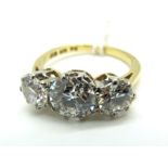 A Large Three Stone Diamond Ring, the central (7mm) old brilliant cut stone claw set between two (
