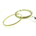 A Modern Bangle, with part textured design, stamped "375", another bangle, of multi alternate tri-