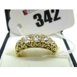 A Victorian Style Five Stone Diamond Ring, the graduated old cut stones within scroll carved setting