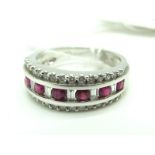 A Modern 18ct White Gold Ruby and Diamond Set Dress Ring, graduated set (finger size N).