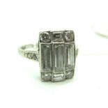 A c.Early XX Century Diamond Set Panel Ring, the rectangular panel rubover set with brilliant and
