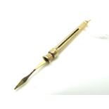 A 9ct Gold Engine Turned Sliding Tooth Pick, (extended length 6.5cm).
