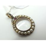 An Edwardian Pearl Set Locket Pendant, as a serpent, graduated set throughout, with central glazed
