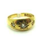 A Chester Hallmarked 18ct Gold Diamond Set Dress Ring, the graduated old cut stones inset, within