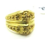 An Unusual Two Row Dress Ring, of textured foliate design, indistinctly stamped "750" (finger size