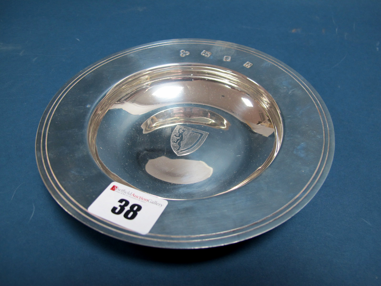 A Hallmarked Silver 'Armada' Dish, P&S, London 1963, bearing shield to the centre, inscribed to