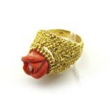 A Vintage Cocktail Dress Ring, set to the centre with a carved coral coloured rose head within