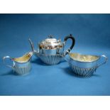 A Hallmarked Silver Three Piece Tea Set, J.G, Sheffield 1894, each of oval semi reeded form, total