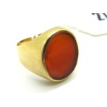 A Gent's Signet Style Ring, with inset oval hardstone panel, within plain setting and shoulders,