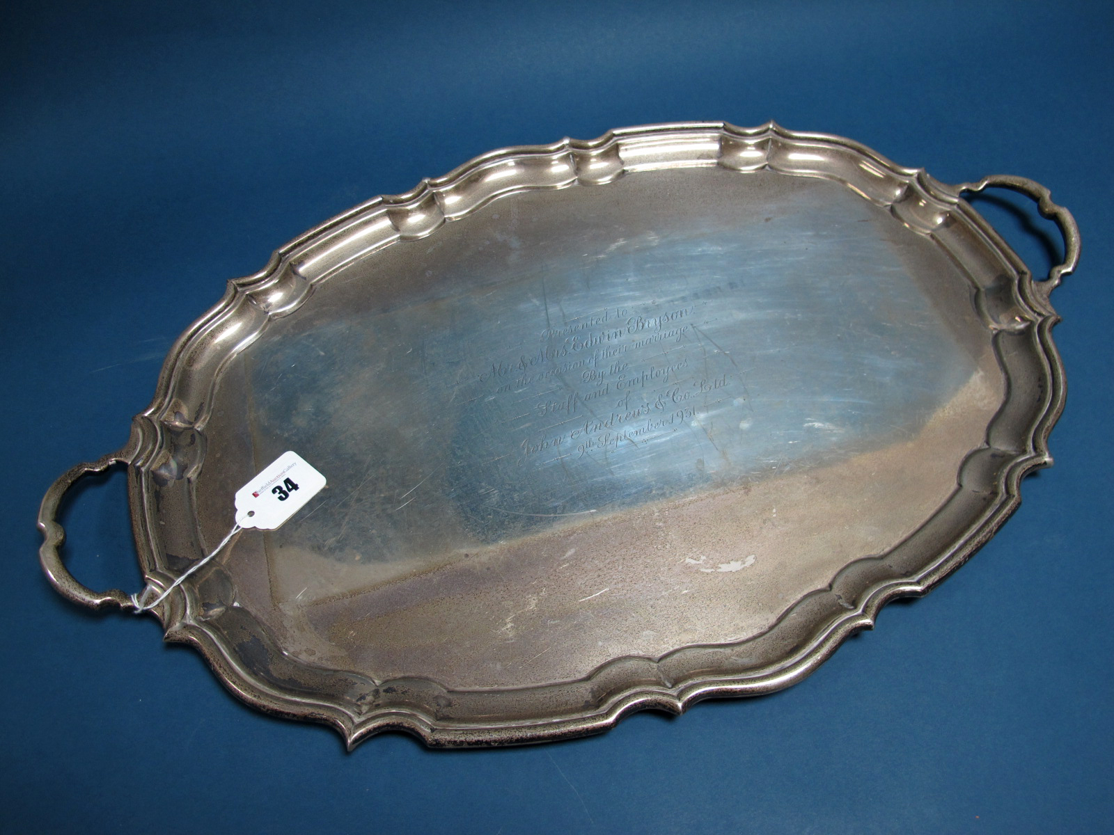 A Hallmarked Silver Twin Handled Tray, CB&S, Sheffield 1931, of shaped oval form between shaped loop