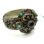 A Highly Decorative Continental Style Wide Hinged Bangle, allover decorated with collet set