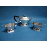 A Hallmarked Silver Three Piece Tea Set, FH, Sheffield 1975, of Art Deco style, with angular