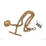 A 9ct Gold Graduated Curb Link Double Albert Chain, to double swivel style clasps, suspending T-
