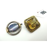 A Large Citrine Single Stone Brooch, rectangular collet set within textured border; A Black Opal