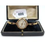A 9ct Gold Cased Ladies Wristwatch, the dial with black Arabic numerals and seconds subsidiary dial,