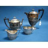 A Matched Hallmarked Silver Four Piece Tea Set, Walker & Hall, Sheffield 1933, 1934, each of oval