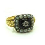 A Pearl Set Mourning Ring, with small rose cut diamond to the centre, between textured shoulders (