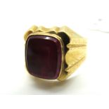 A Continental Style Gent's Signet Ring, with rectangular collet set centre, between ornate