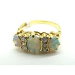 A Victorian Style 18ct Gold Opal and Diamond Set Ring, graduated set, with brilliant cut diamond set