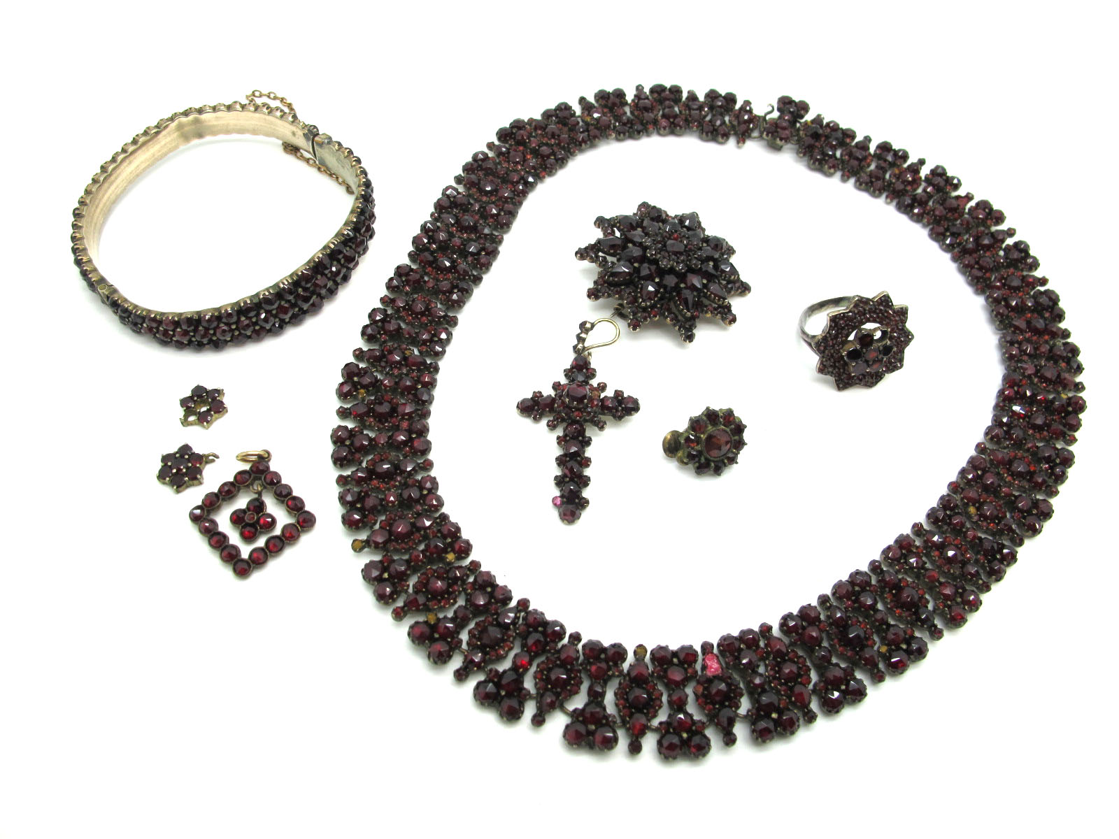 A XIX Century Garnet Set Necklet, of uniform design, set throughout with graduated rose cut