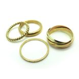 A 9ct Gold Plain Wedding Band, a modern 9ct gold tri-colour linked band ring; a ropetwist ring,