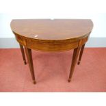 A Late XVIII Century Mahogany Demi-Lune Tea Table, the fold-over top with boxwood stringing, on