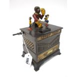 A Cold Painted Cast Iron Moneybox, titled 'Organ Bank', mounted by a monkey with moveable arms,