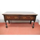 An Early XVIII Century Joined Oak Dresser Base, the top with moulded edge over two single drawers,