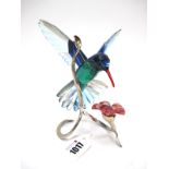 A Swarovski Crystal Paradise Bird Sculpture 'Hummingbird with Flower', on metal stand, 16cm high.
