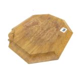 A Robert Thompson Mouseman Oak Bread Board, of rectangular form with canted corners, carved mouse