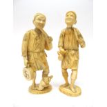 A Pair of Late XIX Century Japanese Sectional Ivory Figures, carved as peasants, one figure