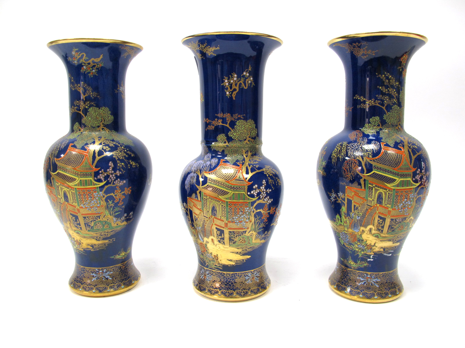 A Garniture of Three Wiltshaw & Robinson 'Carlton Ware' Pottery Vases, painted in multi-coloured