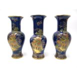 A Garniture of Three Wiltshaw & Robinson 'Carlton Ware' Pottery Vases, painted in multi-coloured