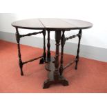 An Early XVIII Century Joined Oak Drop Leaf Table, with oval top on turned and block supports,