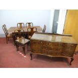 A Good Quality Mid XX Century Walnut Dining Room Suite, with foliate carved borders and cabriole