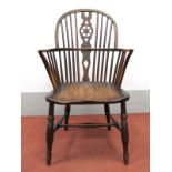 A XIX Century Ash and Elm Windsor Chair, with hooped back, rail supports and splat with star