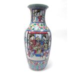 A XIX Century Cantonese Pottery Vase, painted in panels with warriors, scholars and other figures,