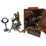 An Early XX Century W. Watson & Sons Ltd Brass and Black Lacquered Metal Microscope, with lens and