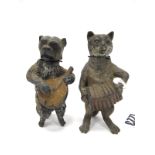 A Pair of Late XIX Century Lead Models of a Nodding Dog and a Cat, each playing a musical instrument