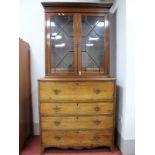 An Early XIX Century Mahogany Secretaire Chest of Drawers, the top with moulded edge, cross banded