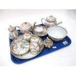 A Mid XIX Century Chinese Porcelain Part Tea Service, painted in enamels with a lady greeting a