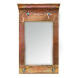 An Art Nouveau Beaten Copper Wall Mirror, of rectangular form with curved top, inset with Ruskin