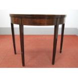 A Late XVIII Century Demi-Lune Tea Table, the fold-over top with boxwood inlay, on tapering legs,
