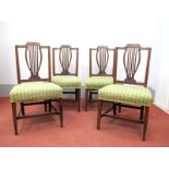 A Set of Four Late XIX Century Mahogany Chairs, the shaped top rail with swag decoration, rail