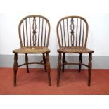 A Pair of XIX Century Yew Wood Chairs, with hooped backs, rail supports, pierced splats with